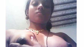 Aroused Tamil woman fondles her firm breasts and nipples