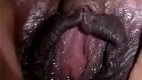 Ebony spreads her pussy close up