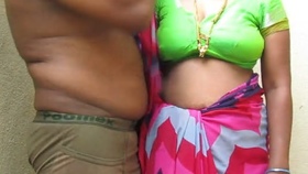 Tamil aunty's large breasts are fondled by her spouse in an erotic film