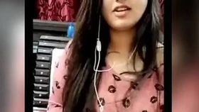 A young and attractive Indian college girl reveals her breasts on a webcam