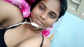 A seductive Indian beauty engages in a video chat