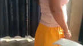 Indian sister prepares for a bath