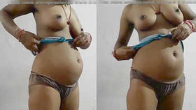 Expectant Indian wife displays breasts