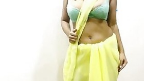 Indian Bhabhi with big tits seduces her boyfriend in yellow sari