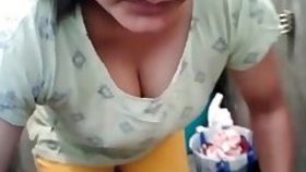 Horny titty washing clothes, showing off her huge tits